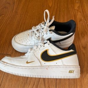 Little boys white black and gold Air Force ones